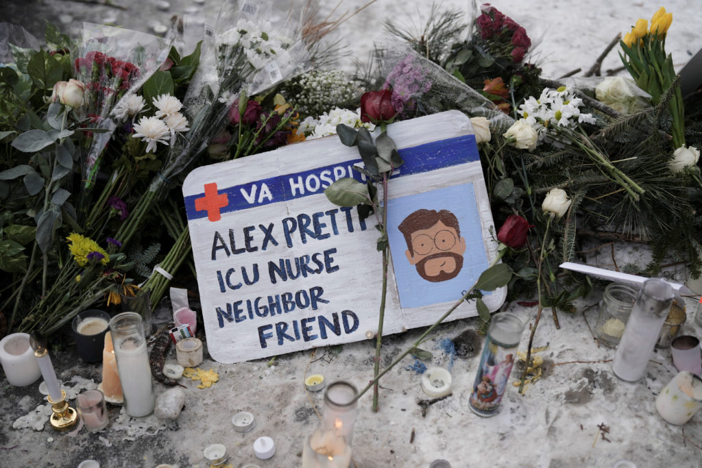 Makeshift memorial at the site where Alex Pretti was fatally shot by federal immigration agents, in Minneapolis