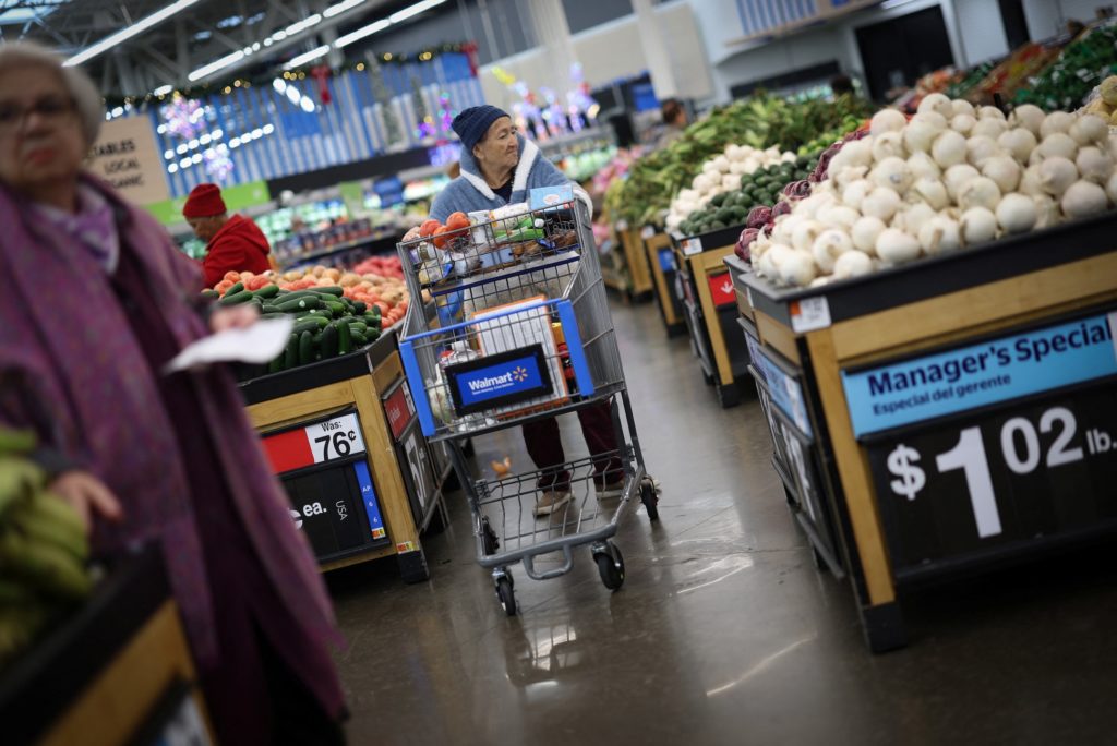 Customers shop for groceries in Walmart Supercenter retail store in North Bergen, New Jersey