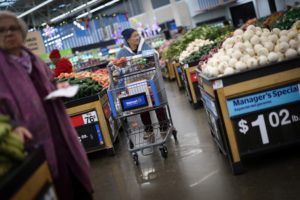 Customers shop for groceries in Walmart Supercenter retail store in North Bergen, New Jersey