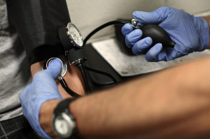 Drug Recognition Expert Instructor checks inmate for drug use at the Maricopa County Fourth Avenue Jail in Phoenix