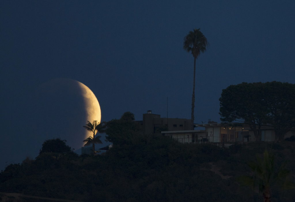 A total lunar eclipse to turn the moon blood red on Tuesday across many continents