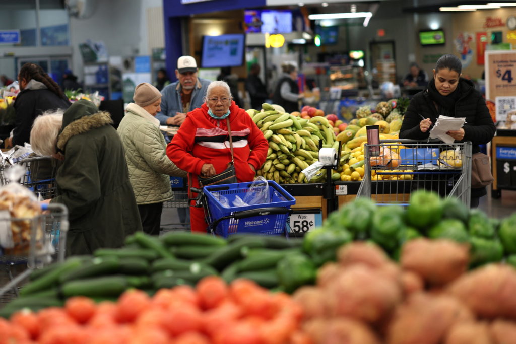 Customers shop for groceries in Walmart Supercenter retail store in North Bergen, New Jersey