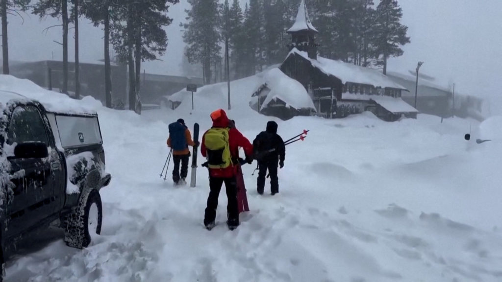 A rescue team departs to the site of an avalanche where skiers were stranded, in Nevada County