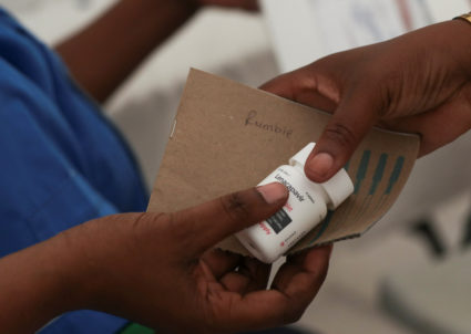 A health official holds Lenacapavir, a long‑acting HIV prevention treatment, in Epworth outside the capital Harare