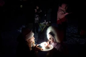 FILE PHOTO: Locals dance the cold away at a blackout party during electricity an outage in Kyiv
