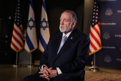 U.S. Ambassador to Israel Mike Huckabee looks on during an interview with Reuters in Jerusalem