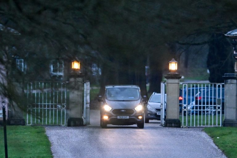 Police vehicles are parked outside Royal Lodge, amid a report of an arrest, in Windsor