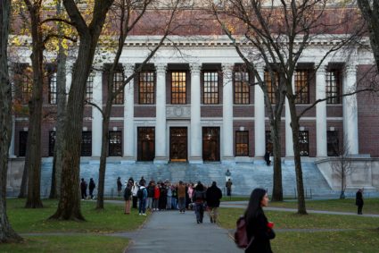 Students walk on the Harvard campus