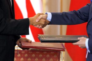 US President Obama and Russian President Medvedev shake hands as exchange signed new Strategic Arms Reduction Treatyat Pra...