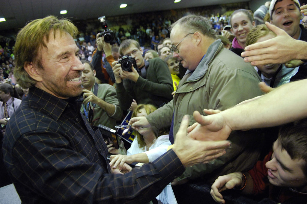 Actor Chuck Norris greets fans as he campaigns for US Republican presidential candidate Huckabee at Clemson University in ...