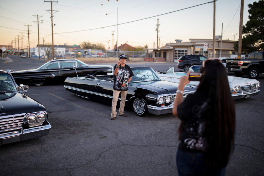 A woman takes photos outside one of the city's most popular restaurants in El Paso