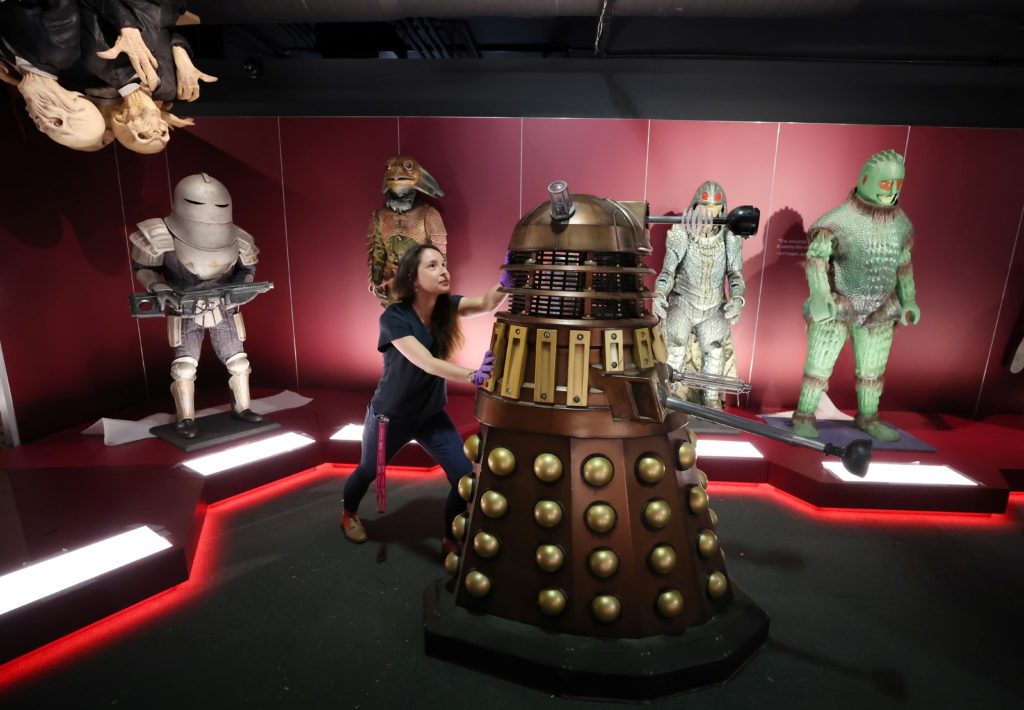 Head of museum exhibitions Catherine Johnson moves a replica of a Dalek into position in the monster vault at the ‘Doctor ...