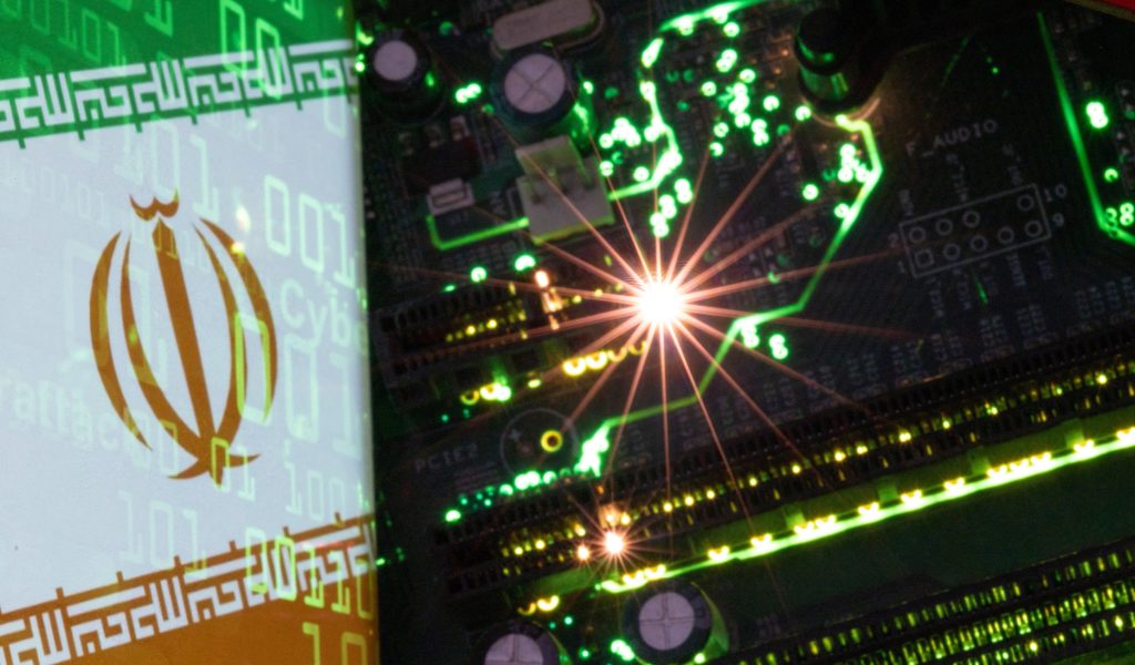 Illustration shows Iranian flag with the word "Cyberattack" and binary codes over it