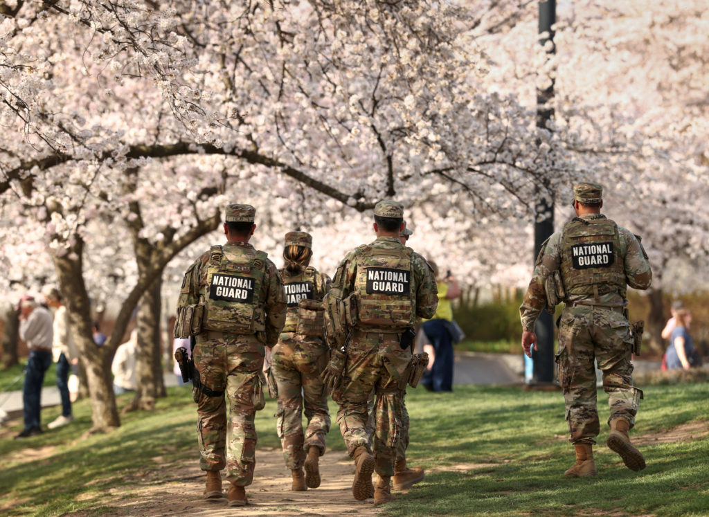 National Guard patrols amid cherry blossoms along the Tidal Basin in Washington