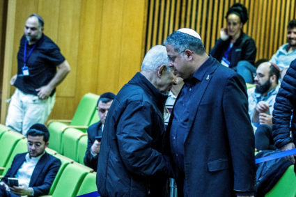 Israeli Prime Minister Benjamin Netanyahu and Israel's far-right National Security Minister Itamar Ben-Gvir shake hands as...