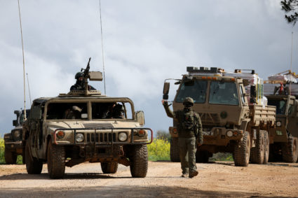 Israeli soldiers take positions near the Israel-Lebanon border in northern Israel