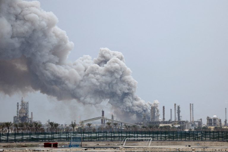 FILE PHOTO: Smoke rises following a strike in Sitra Island