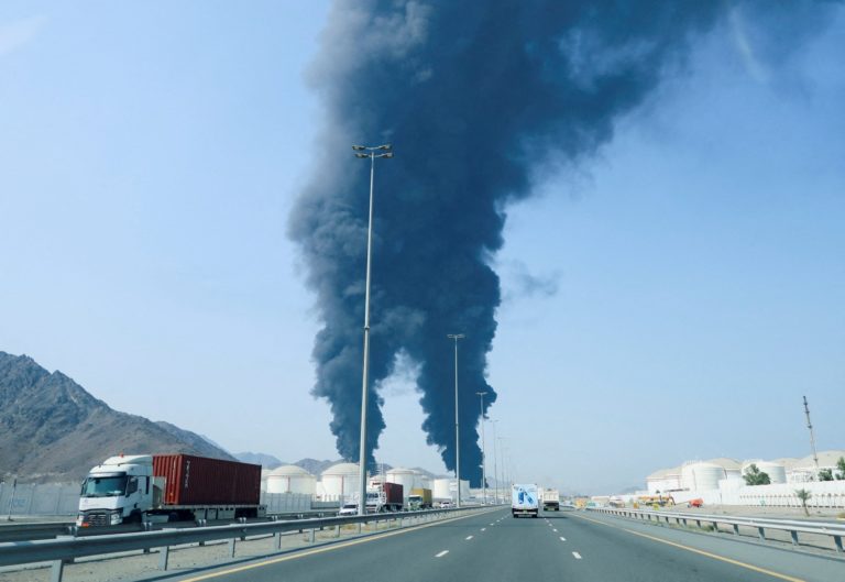 FILE PHOTO: Smoke rises in the Fujairah oil industry zone, caused by debris after interception of a drone by air defenses,...