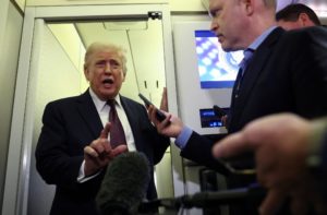 Trump speaks to reporters aboard Air Force One