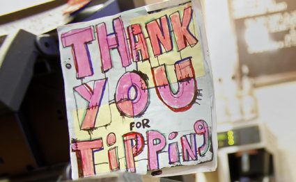 A DipJar, which is an electronic version of the tip jar found in coffee shops is seen on the counter of an Oren's Daily Ro...