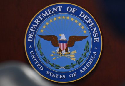 The Department of Defense seal is seen as U.S. Defense Secretary Esper participates in a meeting at the Pentagon in Arling...
