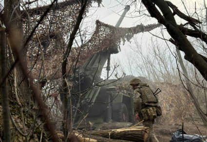 Ukrainian servicemen fire a self-propelled howitzer towards Russian troops at a front line near the town of Pokrovsk
