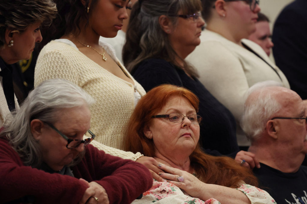 Friends and family members of some of the victims of convicted Gilgo Beach serial killer Rex Heuermann attend a press conf...