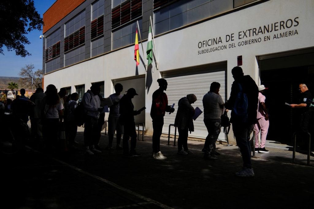 Migrants rush to apply under Spain's new mass legalization program