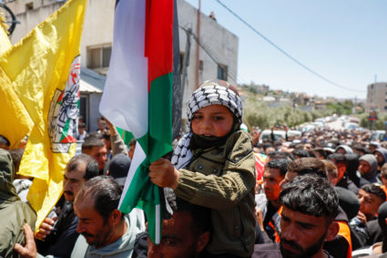 Mourners attend a funeral for two Palestinians, in Al-Mughayir village near Ramallah