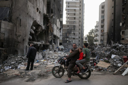 People visit the site of Israeli strikes, following the ceasefire, in Beirut