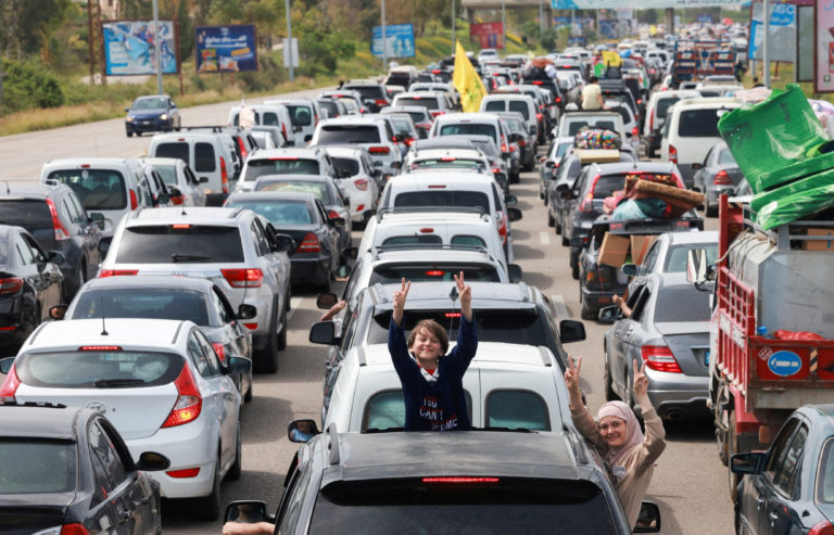 Displaced people make their way as they return to their homes after a 10-day ceasefire between Lebanon and Israel went int...