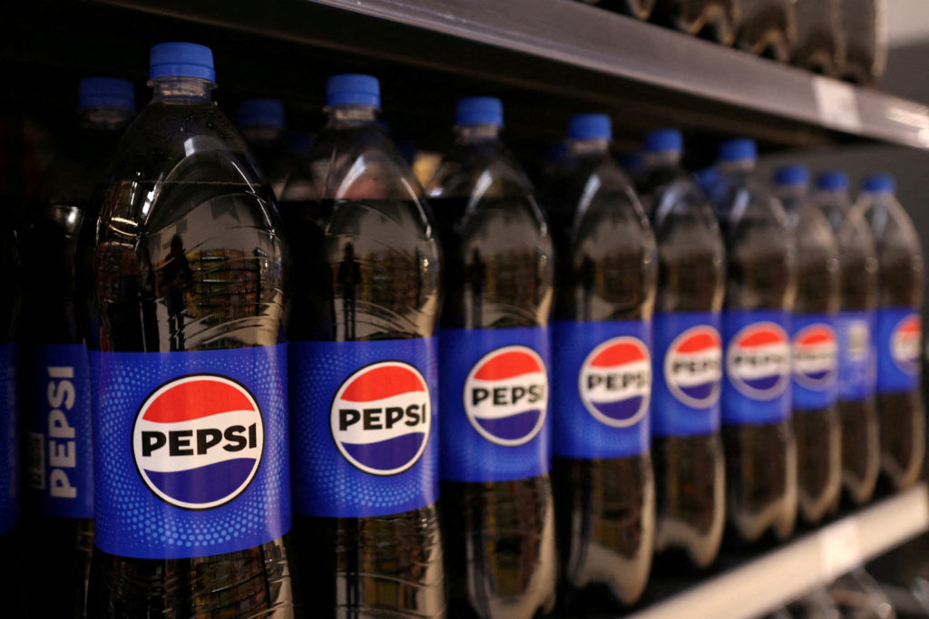 FILE PHOTO: Bottles of Pepsi are displayed on a shelf in supermarket