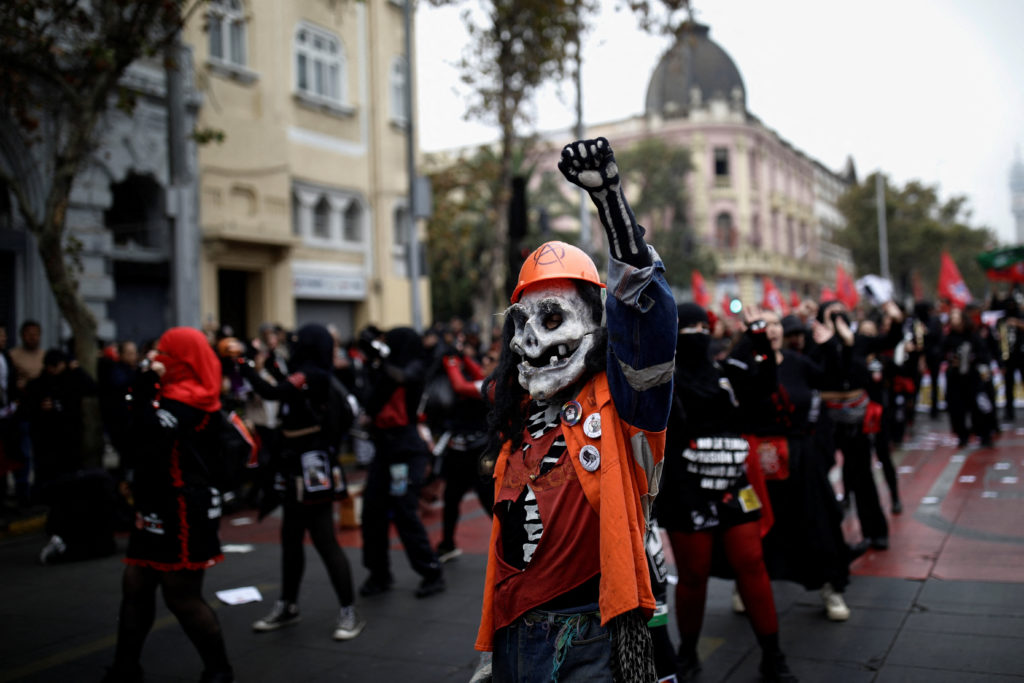 Chilean workers march to mark the International Workers Day, in Santiago