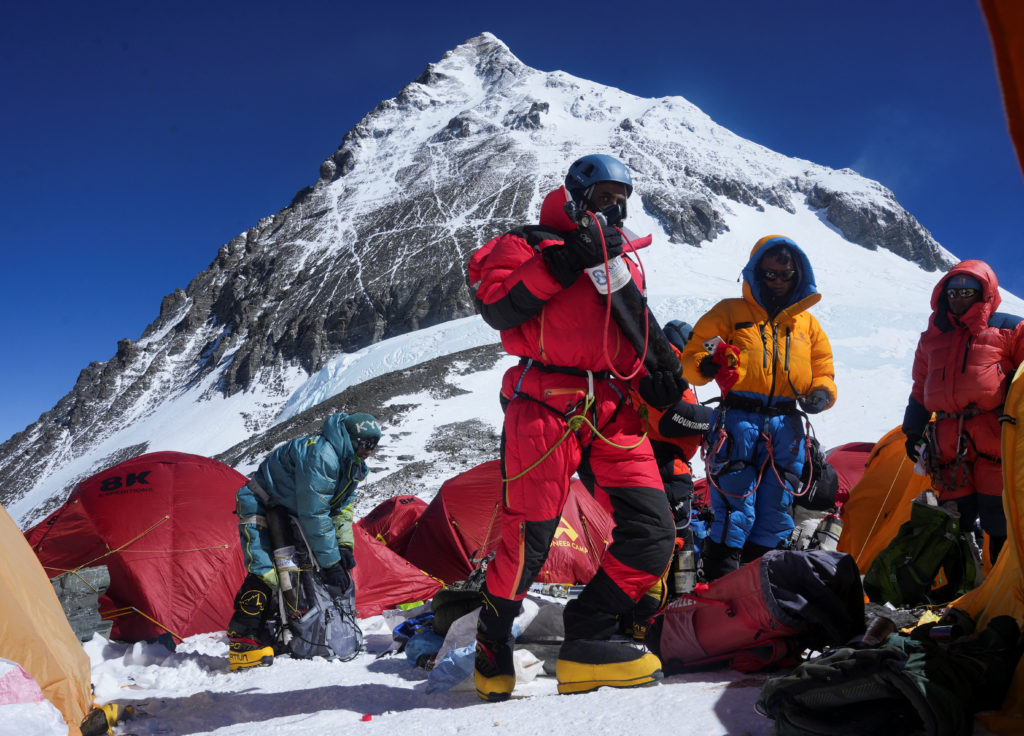 Mount Everest on the backdrop as members of an expedition team prepare to ascend the mountain, at Camp 4 in the Solukhumbu...