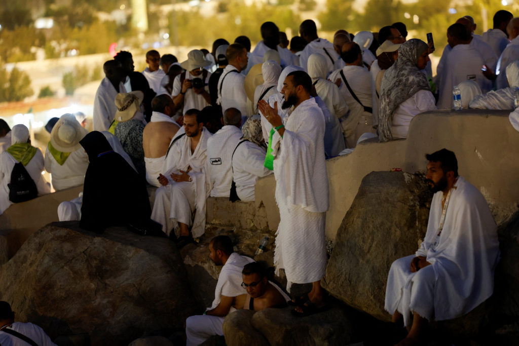 Muslim pilgrims gather at Mount of Mercy on the plain of Arafat during the annual hajj pilgrimage, outside the holy city o...