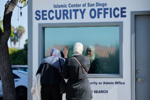 People pay their respects the morning following a shooting, at Islamic Centre of San Diego