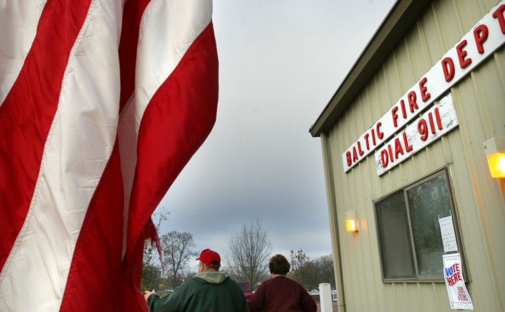 Voters leave polling station in South Dakota.
