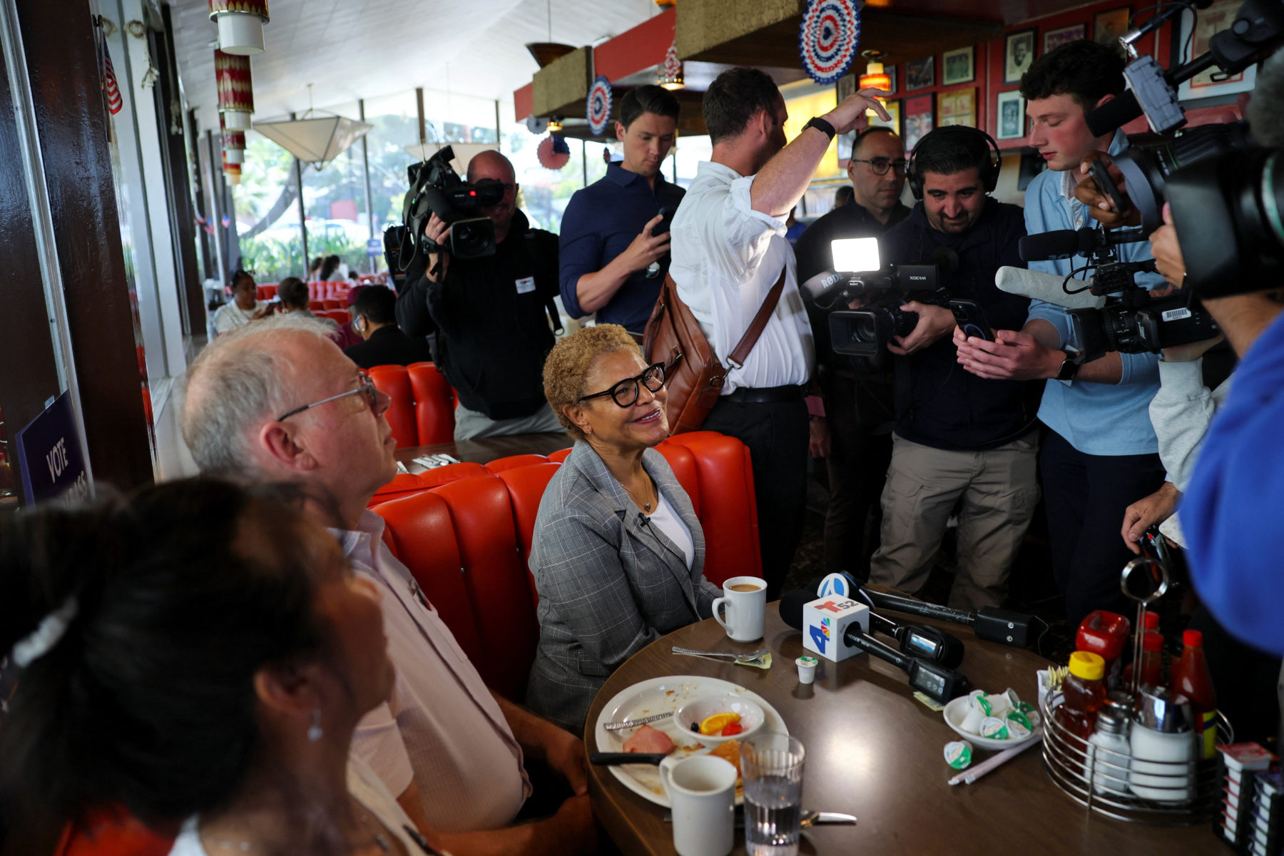 Los Angeles Mayor Karen Bass greets diners ahead of the primary election in Los Angeles