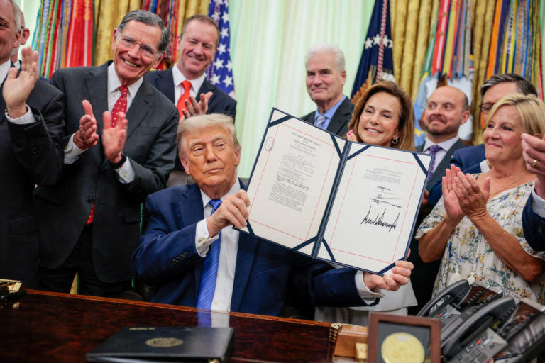 U.S. President Trump signs the Secure America Act in the Oval Office at the White House