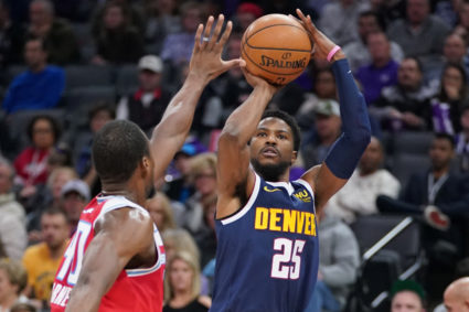 FILE PHOTO: Malik Beasley shoots the ball in a game in 2019 in Sacramento