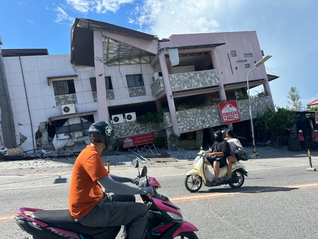 A 7.8 magnitude quake in the Philippines kills at least 32, collapses buildings and triggers tsunami