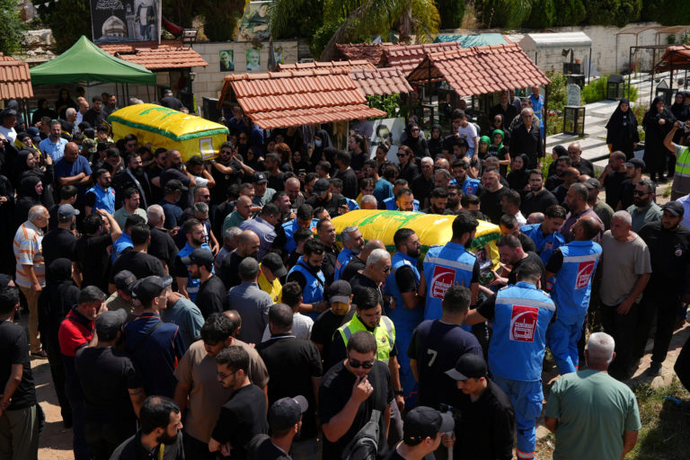 Mourners attend the funeral of two Hezbollah fighters, who were killed before an interim deal between the U.S. and Iran in...
