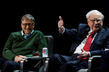 Warren Buffett, chairman and CEO of Berkshire Hathaway, speaks while Bill Gates looks on at Columbia University in New York