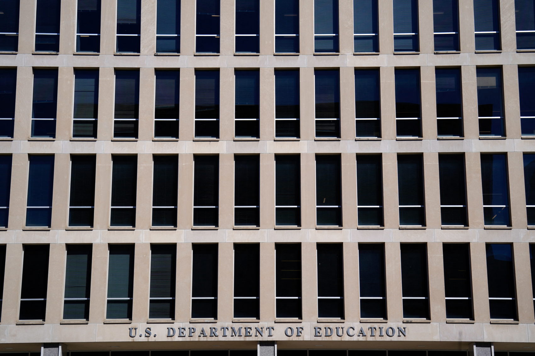 Demonstrators rally in support of U.S.Department of Education outside its building in Washington