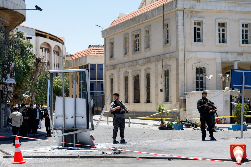 Explosions rock Syria's capital during French President Macron's visit