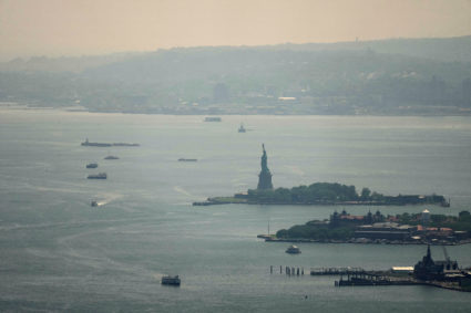 The Statue of Liberty is seen through a cover of wildfire smoke in New York