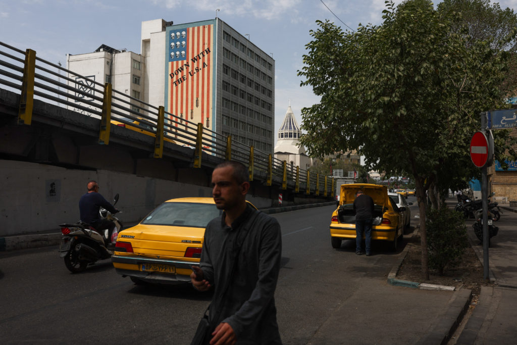 Iran says it is suspending commitments to interim deal with U.S. as they exchange attacks