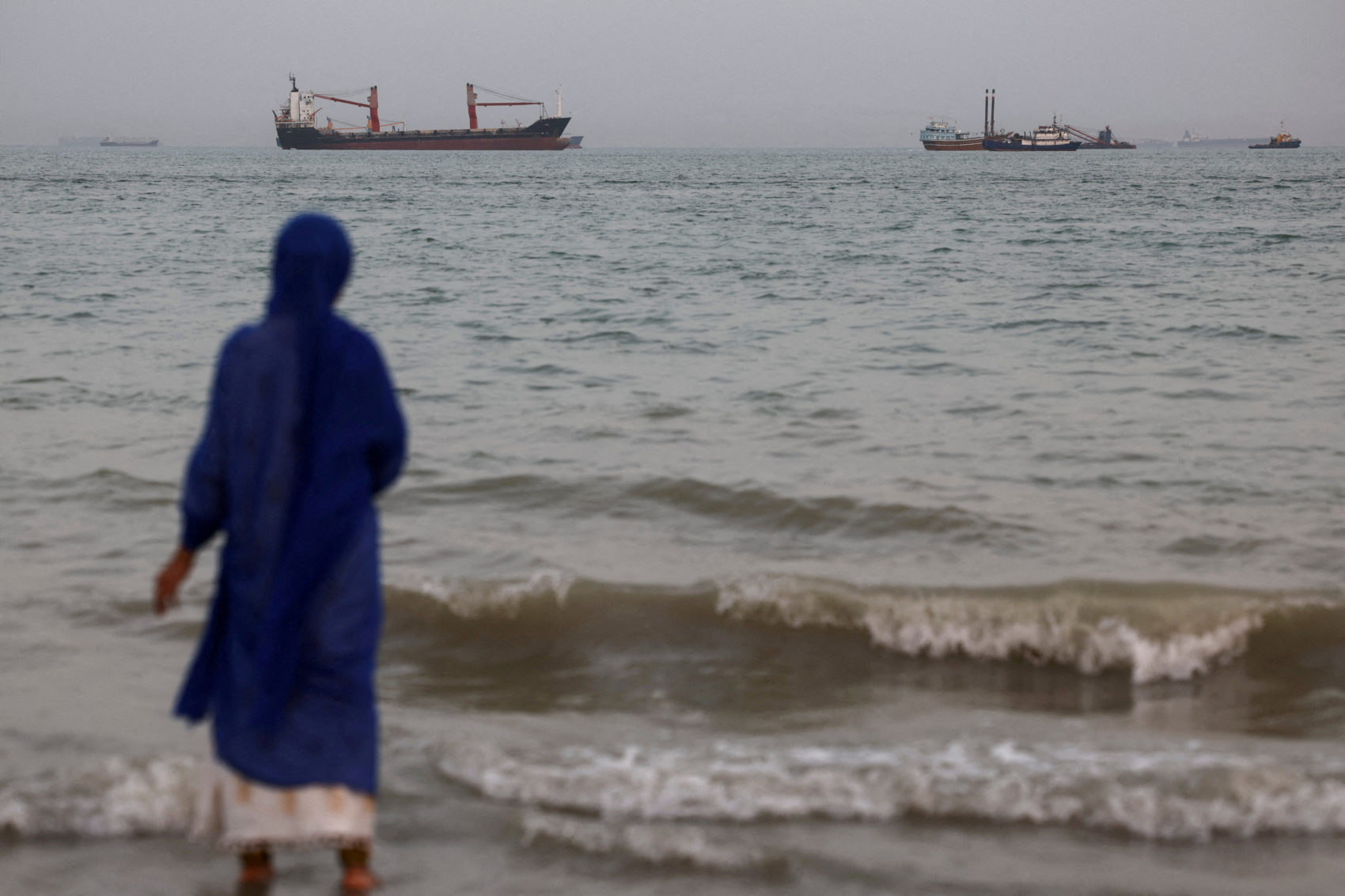 FILE PHOTO: Vessels in the Strait of Hormuz are visible near the beach of Bandar Abbas