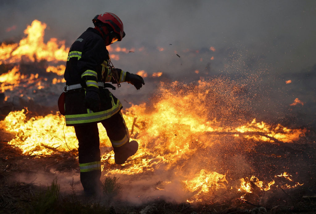 Firefighters race to control massive blazes approaching major cities in France and Spain