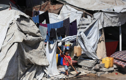 Displaced Palestinians shelter at a tent camp, in Gaza City
